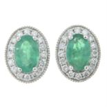 A pair of 18ct gold emerald and brilliant-cut diamond cluster earrings.