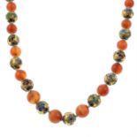 An enamel and carnelian bead necklace.