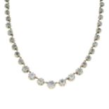 A late Victorian silver graduated colourless paste riviere necklace.