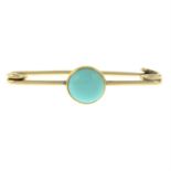 An early 20th century gold turquoise bar brooch.