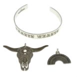 A small selection of jewellery, to include two charms and a bangle, by Carter Gore.