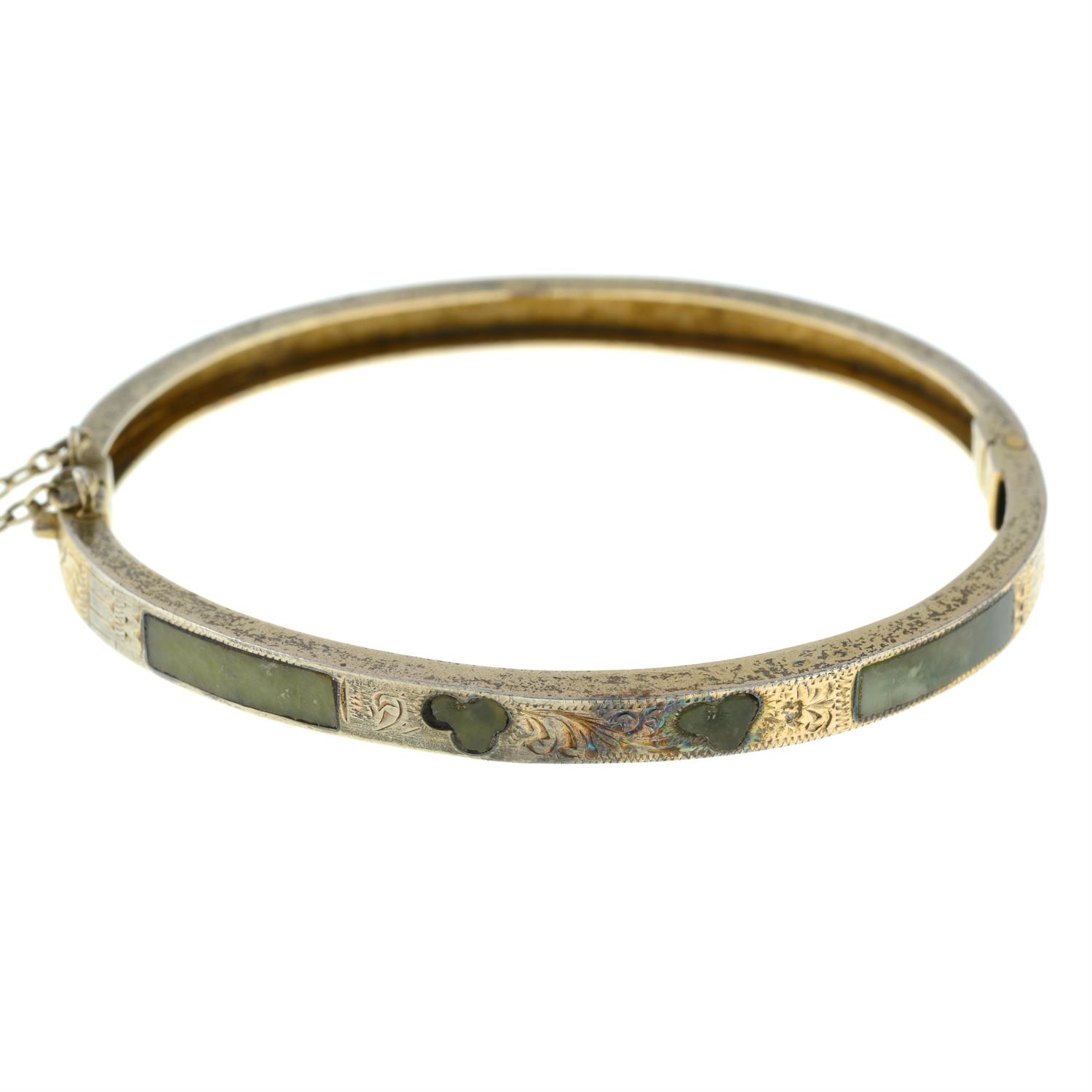 An Edwardian silver Connemara marble hinged bangle.