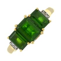 An 18ct gold green tourmaline three stone-ring, with diamond shoulders.