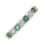 An 18ct gold emerald and brilliant-cut diamond half eternity ring.