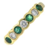 An 18ct gold brilliant-cut diamond and emerald seven-stone ring.