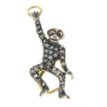 A rose-cut diamond and ruby pendant, in the form of a monkey.