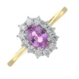 An 18ct gold pink sapphire and brilliant-cut diamond cluster ring.