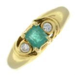 A 18ct gold emerald and briliant-cut diamond three-stone ring.