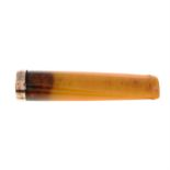 An early 20th century 9ct gold modified amber cigarette holder.