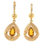 A pair of yellow paste drop earrings.