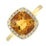 An 18ct gold citrine and brilliant-cut diamond cluster ring.