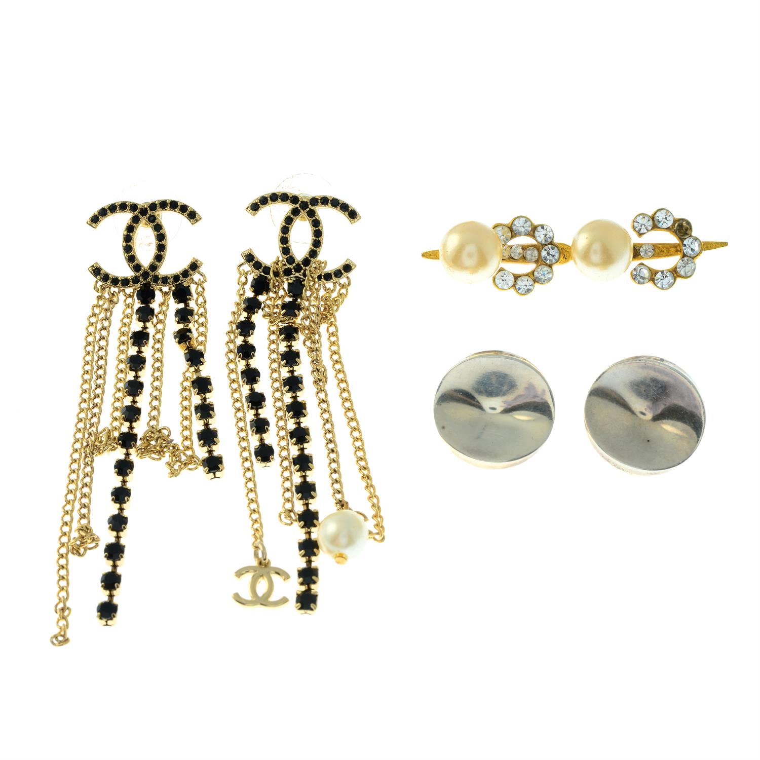 A pair of silver clip-on earrings, by Nanna Ditzel for Georg Jensen, and two items of jewellery,