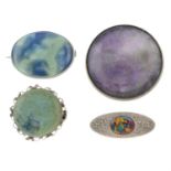 A selection of early 20th century brooches, to include fluorite, ceramic and vari-hue enamel