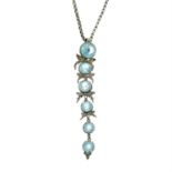 An early 20th century blue paste folite drop pendant with chain.