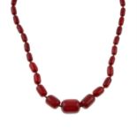 A red Bakelite single-strand slightly graduated bead necklace.