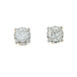 A pair of brilliant-cut diamond single-stone stud earrings.