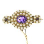 An early 20th century gold amethyst and split pearl cluster brooch.