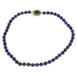 A lapis lazuli bead necklace, with lapis lazuli cabochon push-piece clasp.