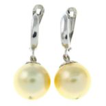 A pair of cultured pearl drop earrings, with diamond accents.