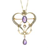 An early 20th century 9ct gold amethyst and seed pearl openwork pendant, with later chain.