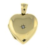 A 9ct gold heart-shape locket, with diamond highlight.