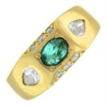 An emerald and and vari-cut diamond dress ring.