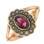 An early 20th century 9ct gold garnet and split pearl cluster ring.