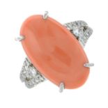 A coral and brilliant-cut diamond dress ring.