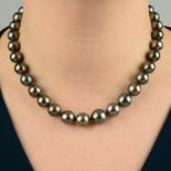 A graduated cultured pearl necklace, with a brilliant-cut diamond clasp.