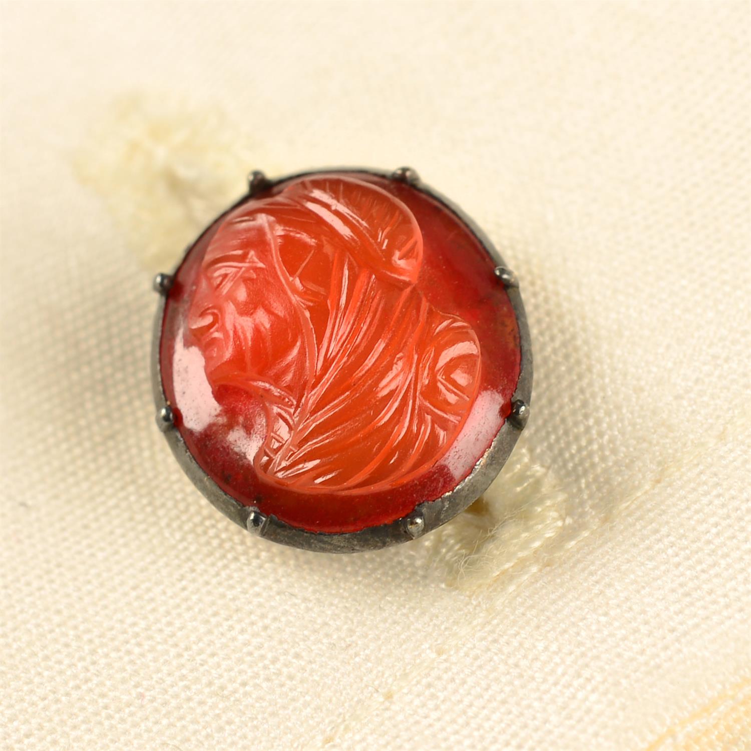 A pair of 19th century gold carnelian cameo cufflinks, each carved to depict a gentleman in profile.