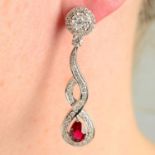 A pair of ruby and pavé-set diamond drop earrings.