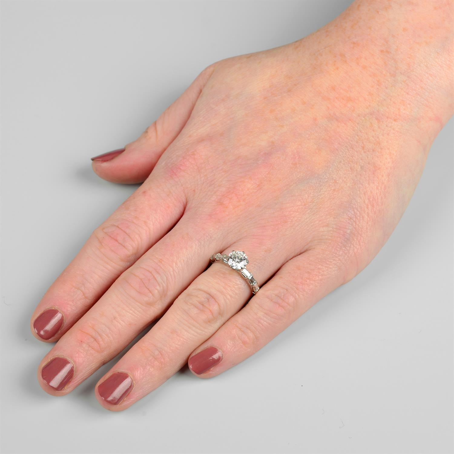 An 18ct gold brilliant-cut diamond single-stone ring, with rectangular-shape diamond shoulders. - Image 5 of 5