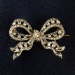 An early 20th century silver and gold old and rose-cut diamond bow brooch.