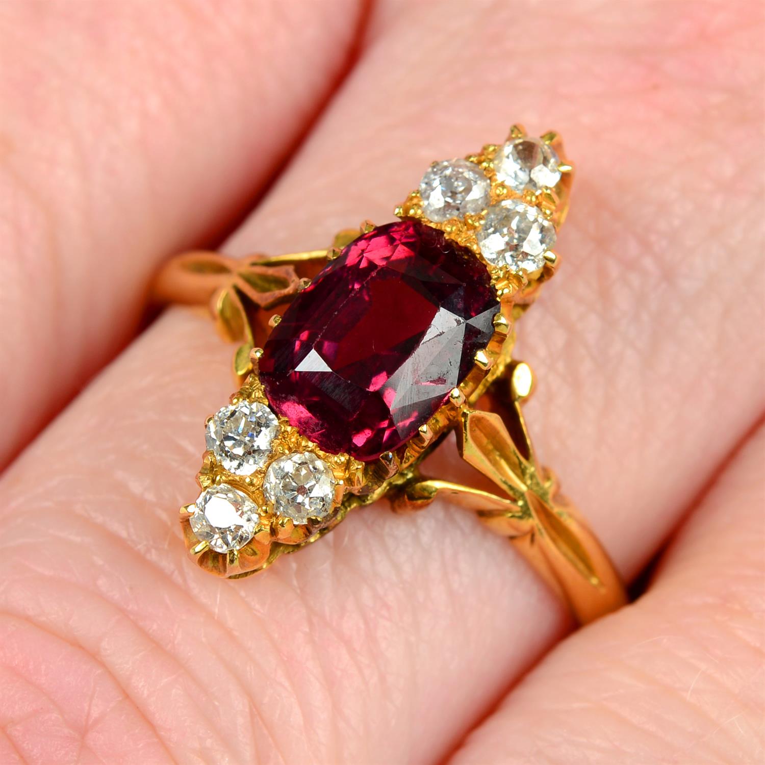 An early 20th century 18ct gold garnet and old-cut diamond ring.