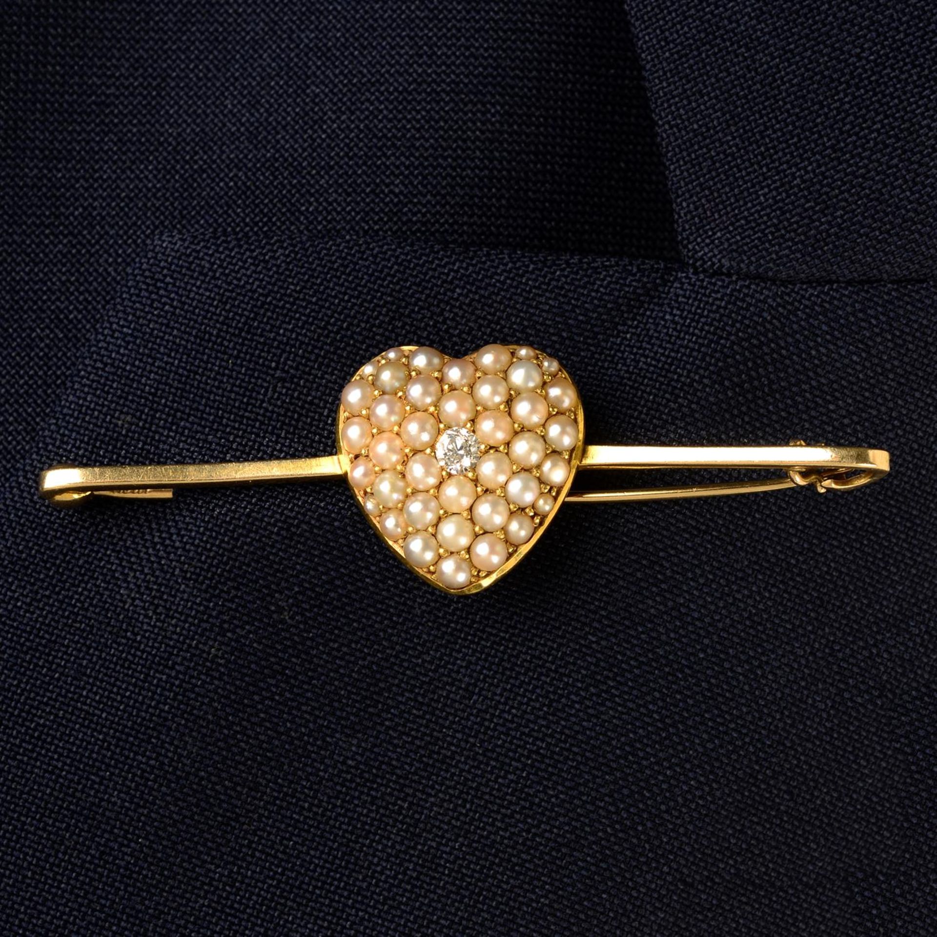 A late Victorian gold old-cut diamond and pavé-set split pearl heart, on later 9ct gold bar brooch.