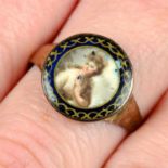An early to mid 19th century gold portrait miniature ring, with blue and gilt painted surround.