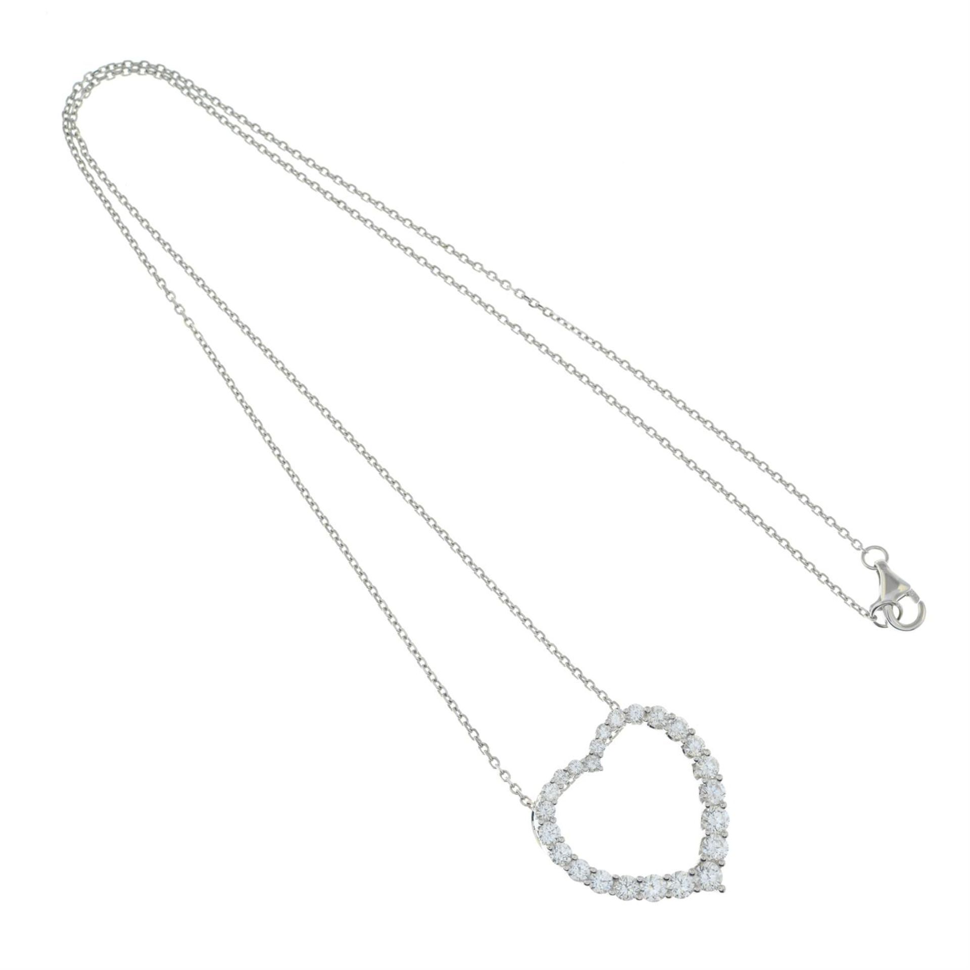 A graduated brilliant-cut diamond heart-shape pendant, with trace-link chain. - Image 4 of 5