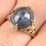 A star sapphire and brilliant-cut diamond dress ring.