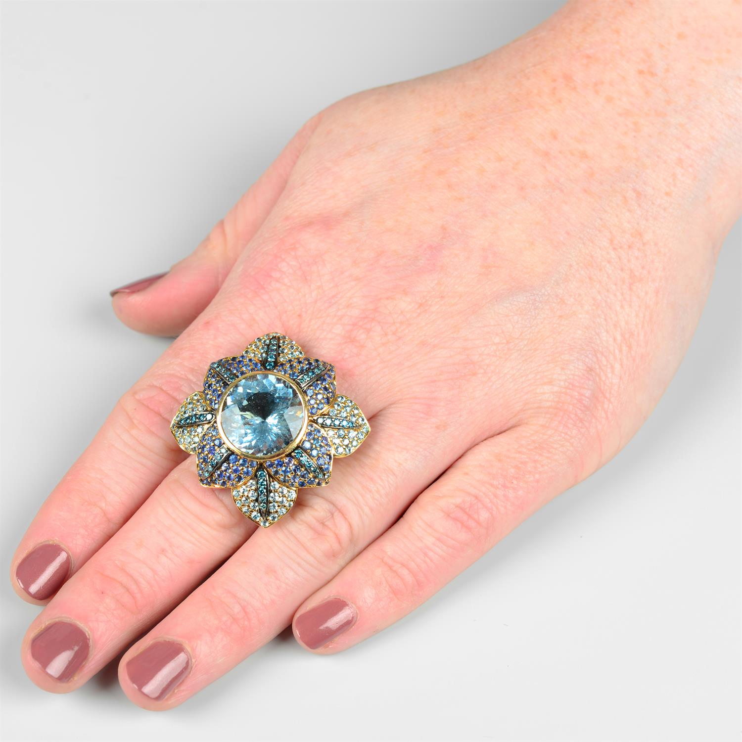 An aquamarine, sapphire and colour-treated 'blue' diamond floral ring, by Zorab Creations. - Image 5 of 5