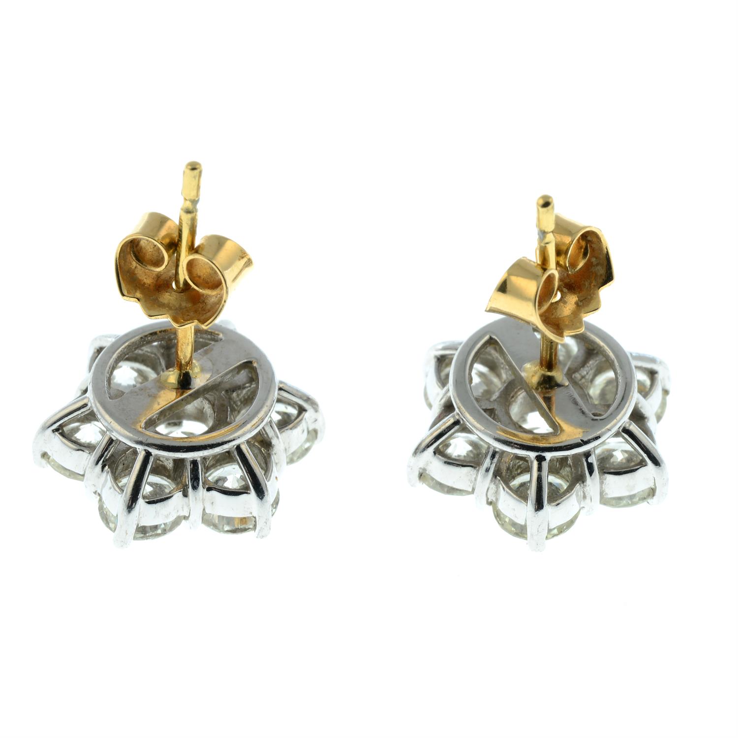 A pair of 18ct gold brilliant-cut diamond floral cluster earrings. - Image 3 of 3