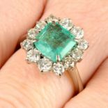 An emerald and circular-cut diamond cluster ring.