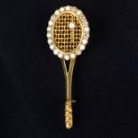 A brilliant-cut diamond tennis racket brooch.