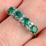 An emerald four-stone ring, with single-cut diamond spacers.