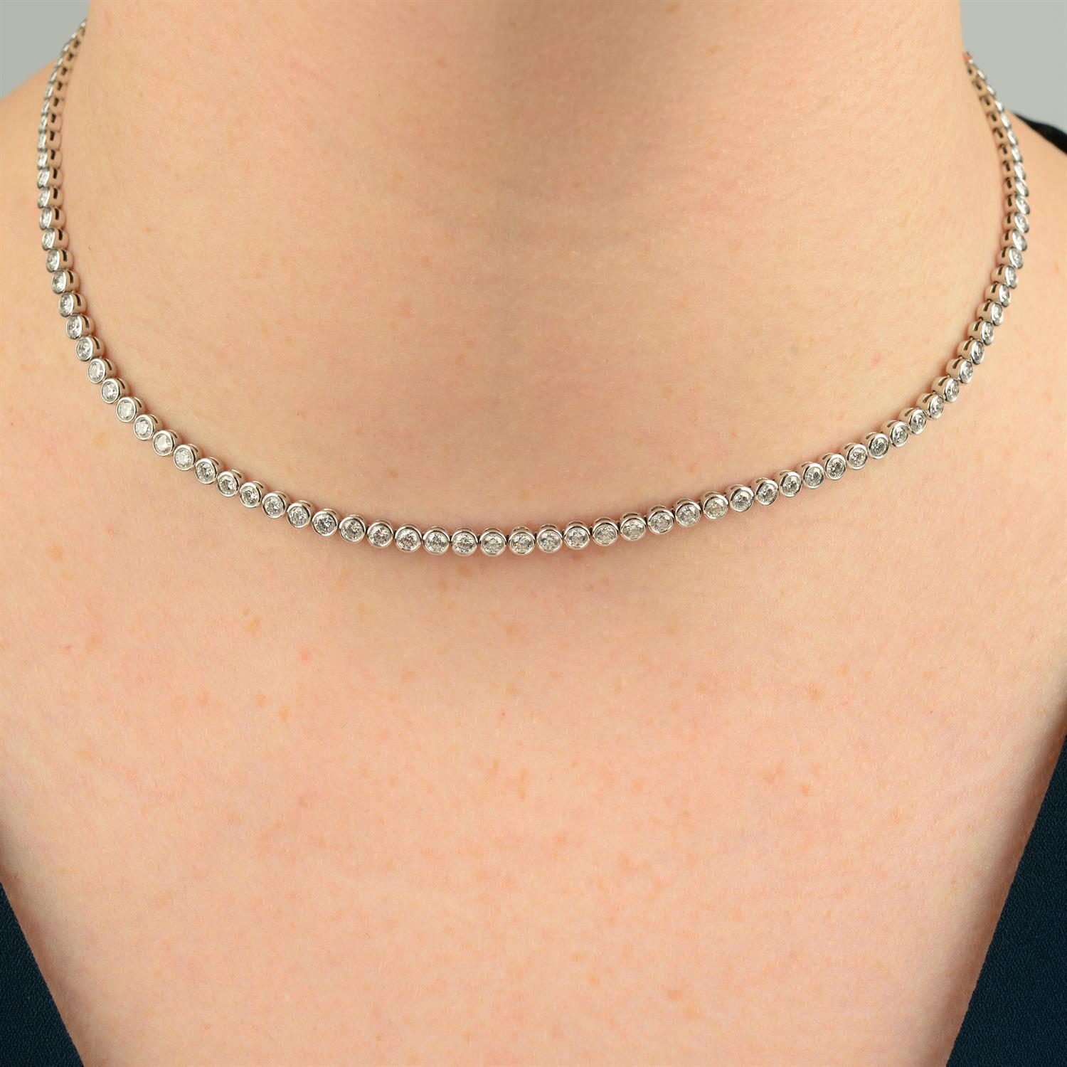 An 18ct gold brilliant-cut diamond collet line necklace, by De Beers.