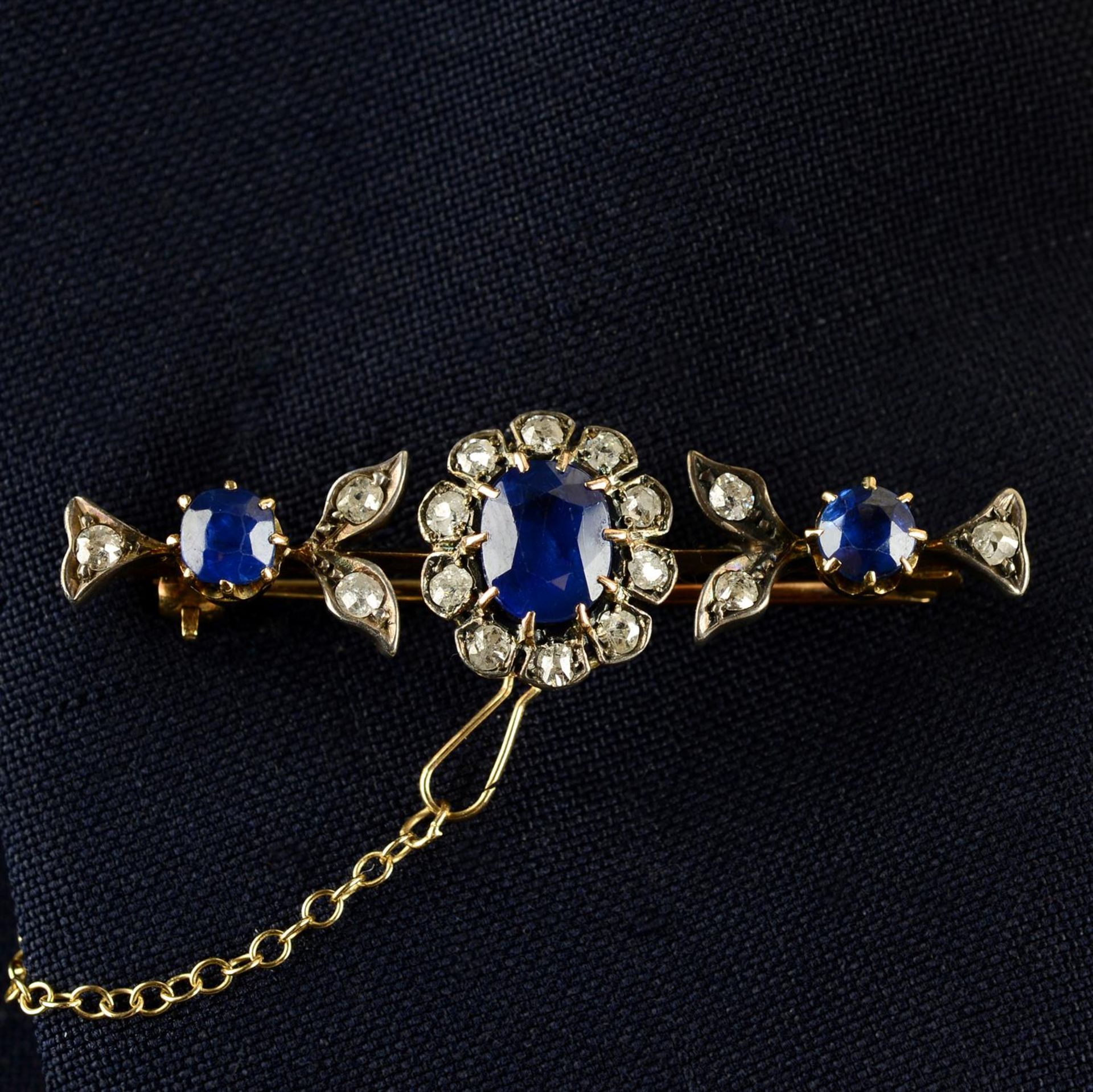 A late Victorian 15ct gold sapphire and old-cut diamond floral bar brooch.