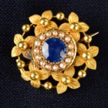 An early 20th century gold sapphire and split pearl floral brooch, with glazed locket reverse.