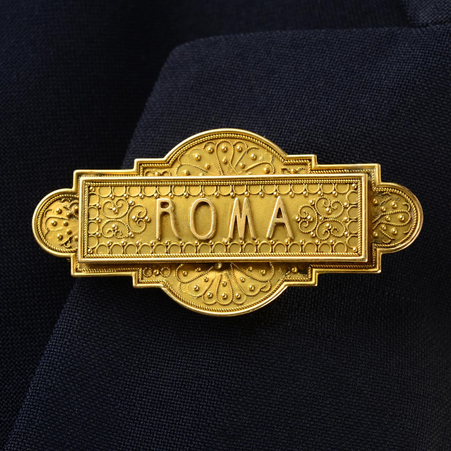 A mid to late 19th century gold cannetille 'ROMA' brooch.