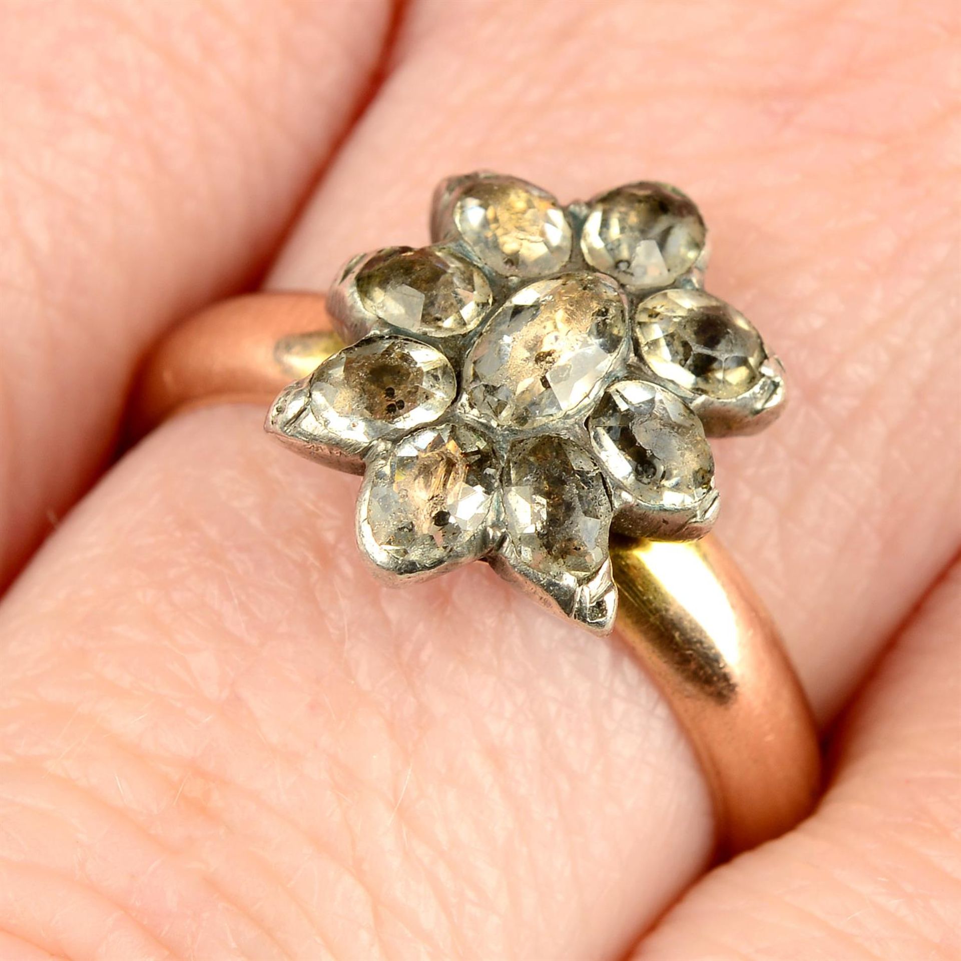 A late Georgian black spot paste cluster ring head, on later 9ct gold band.