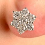 A pair of brilliant-cut diamond cluster earrings.