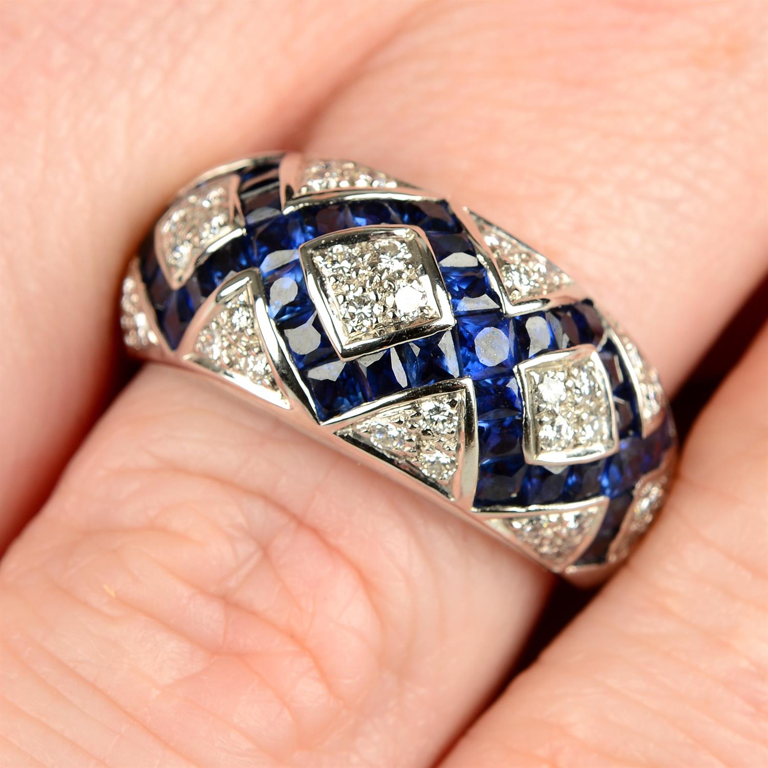 A limited edition 18ct gold calibre-cut sapphire and pavé-set diamond ring, by Fabergé.